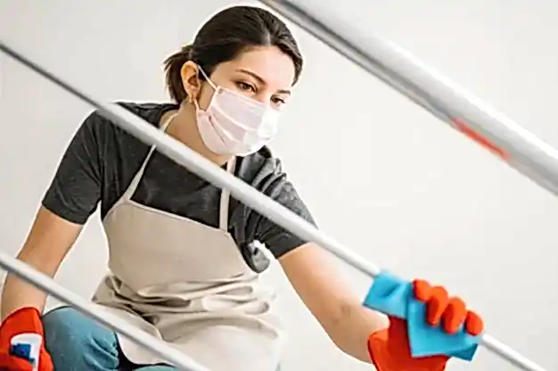 cleaning woman wearing medical mask 23 2148521048 1
